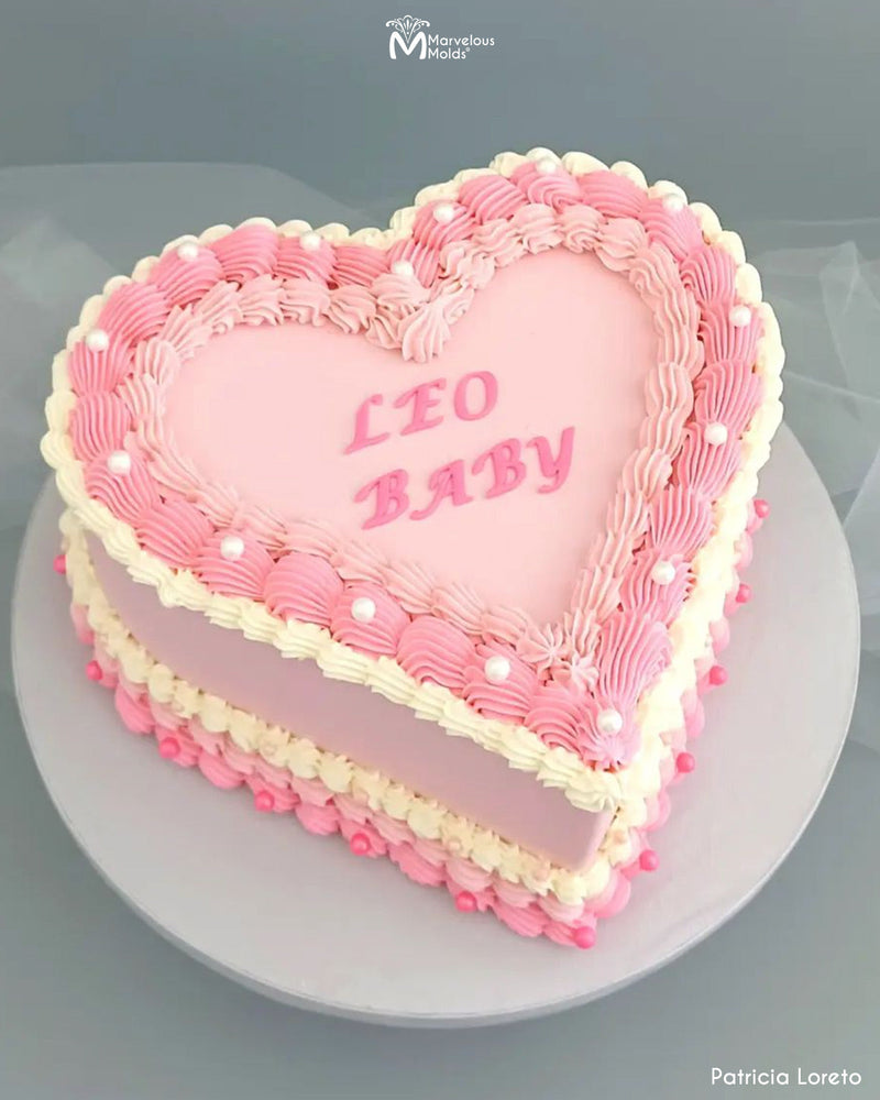 Heart Shaped Leo Zodiac Birthday Cake decorated using the Marvelous Molds Calligraphy Uppercase Flexabet Letter Maker