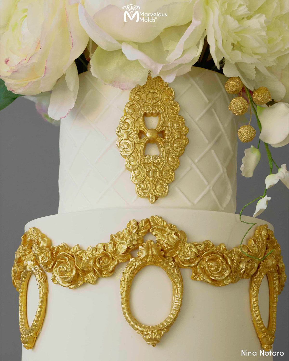 White Wedding Cake Decorated using the Enchanting Brooch Silicone Mold by Marvelous Molds