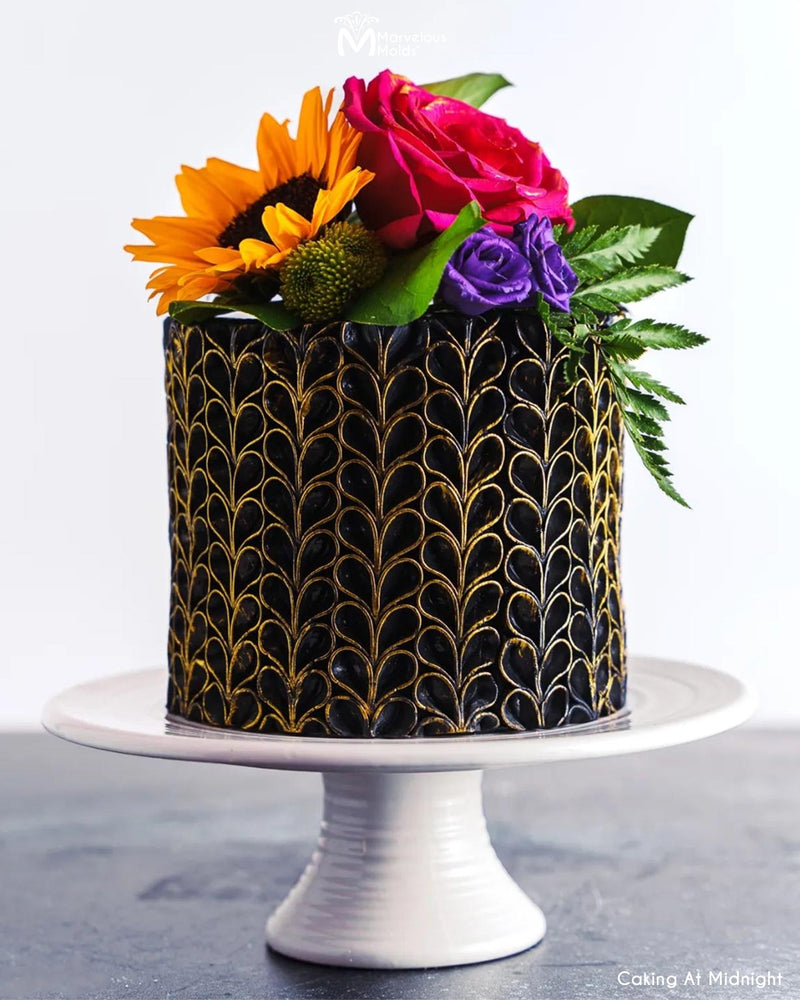 Black and Gold Decorated Cake with a Ruffle Design, Created with the V-Petal Ruffle Silicone Simpress Mold by Marvelous Molds