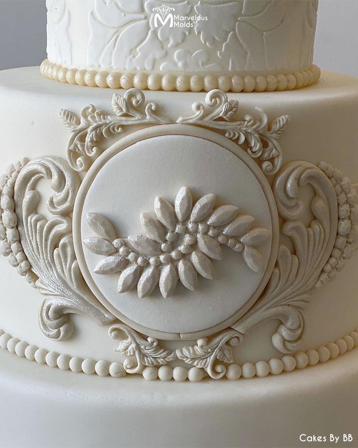 White Wedding Cake with Jeweled Decorations, Created Using the Swanky Brooch Silicone Mold by Marvelous Molds