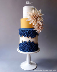 A Three Tiered Faultline Cake with a Royal Blue Geode Rock Candy Pattern Decorated Using Marvelous Molds Diamonds in the Rough Simpress®