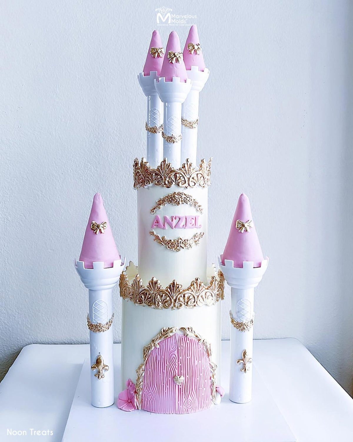 Princess Castle Cake with pink accents, decorated using Marvelous Molds Betty Lace Mold