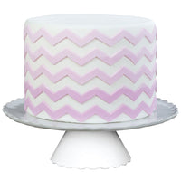 Decorated cake image showing the Small Chevron Food Safe Silicone Onlay Ribbon for Fondant Cake Decorating by Marvelous Molds