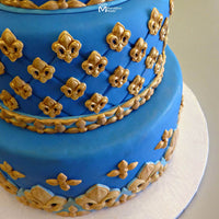Blue and Gold Cake Decorated with the Marvelous Molds Mini Fleur De Lis Silicone Mold