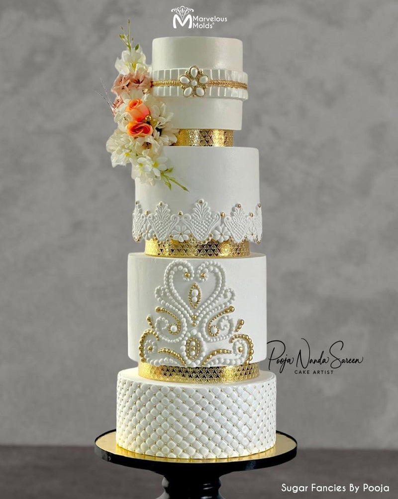 White and Gold Wedding Cake Created Using the Marvelous Molds Pearl Radiance Silicone Mold for Cake Decorating