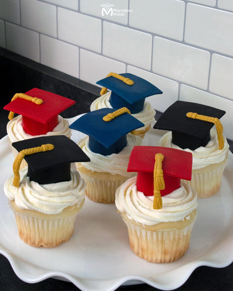 Graduation Party Cupcakes Topped with Graduation Caps, Decorated with the Marvelous Molds Grand Tassel Drop Silicone Mold for Cake Decorating