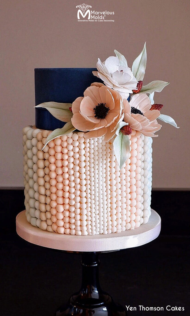 Navy and Pink Cake Decorated with Pearl Strings, Created Using the Marvelous Molds PinchPro Pearls 8mm Silicone Mold for Cake Decorating