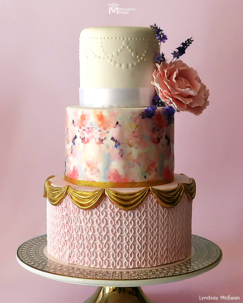 Light Pink Floral Cake with Gold Swag Borders, with Piped Texture Created Using the Marvelous Molds Piped Perfection Simpress Silicone Mold