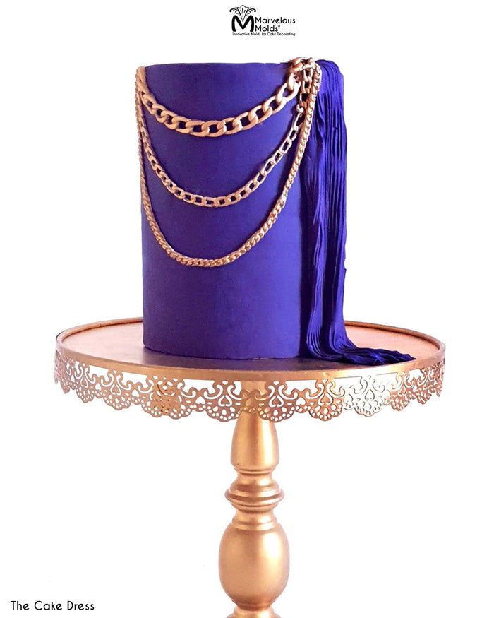 Purple Fashion Cake with Edible Sugar Plissé Fabric Design and Draped Gold Chains, Decorated Using the Marvelous Molds Small Chain PinchPro Silicone Mold for Cake Decorating