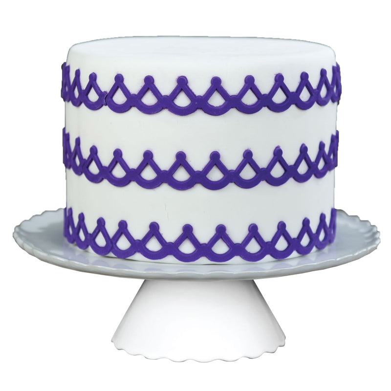 Decorated Cake Image Showing the Regalia Food Safe Silicone Onlay for Fondant Cake Decorating by Marvelous Molds