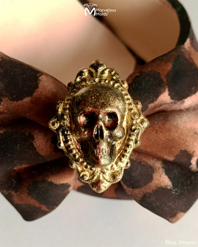 Cheetah Print Edible Sculpted High Heel Stiletto Cake with Bow Details Decorated Using the Skull Cameo Silicone Mold by Marvelous Molds