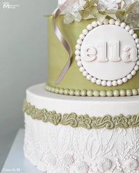 Sage and White Lace Birthday Cake with a Lace Border Decorated Using the Marvelous Molds Lydia Lace Silicone Mold