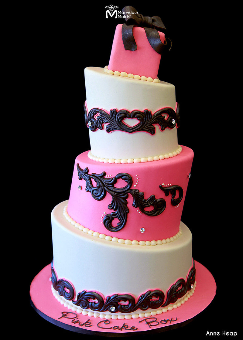 Pink Cake with Scroll Decorations, Created Using the Swirl Centerpiece Silicone Mold by Marvelous Molds