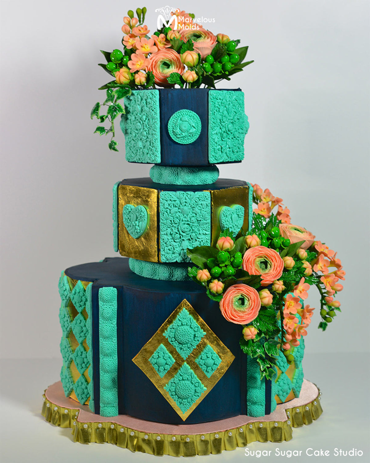 Turquoise and Navy Cake with Floral Embellishments, Decorated Using the Marvelous Molds Quadrille Border Silicone Mold for Cake Decorating