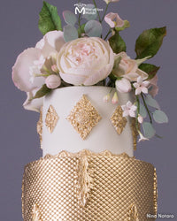 Wedding Cake with Gold Embellishments Decorated Using the Small Quadrille Medallion Silicone Mold by Marvelous Molds