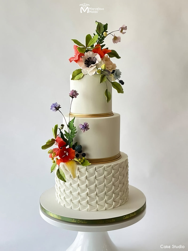 White Elegant Wedding Cake with Draping Ribbon Ruffles, Created Using the Marvelous Molds Ribbon Ruffle Simpress Silicone Mold