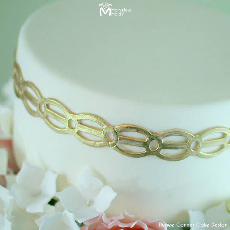 White Wedding Cake with a Gold Border Created Using the Marvelous Molds Lovely Links Silicone Onlay
