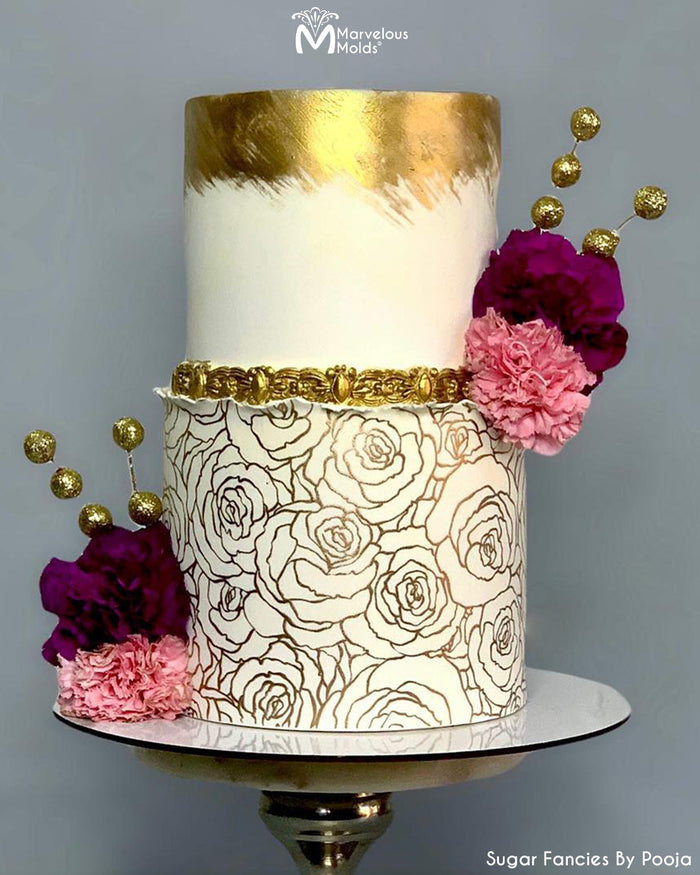 White with Golden Floral Detailed Wedding Cake With a Gold Border Created Using the Marquis Border Silicone Mold by Marvelous Molds