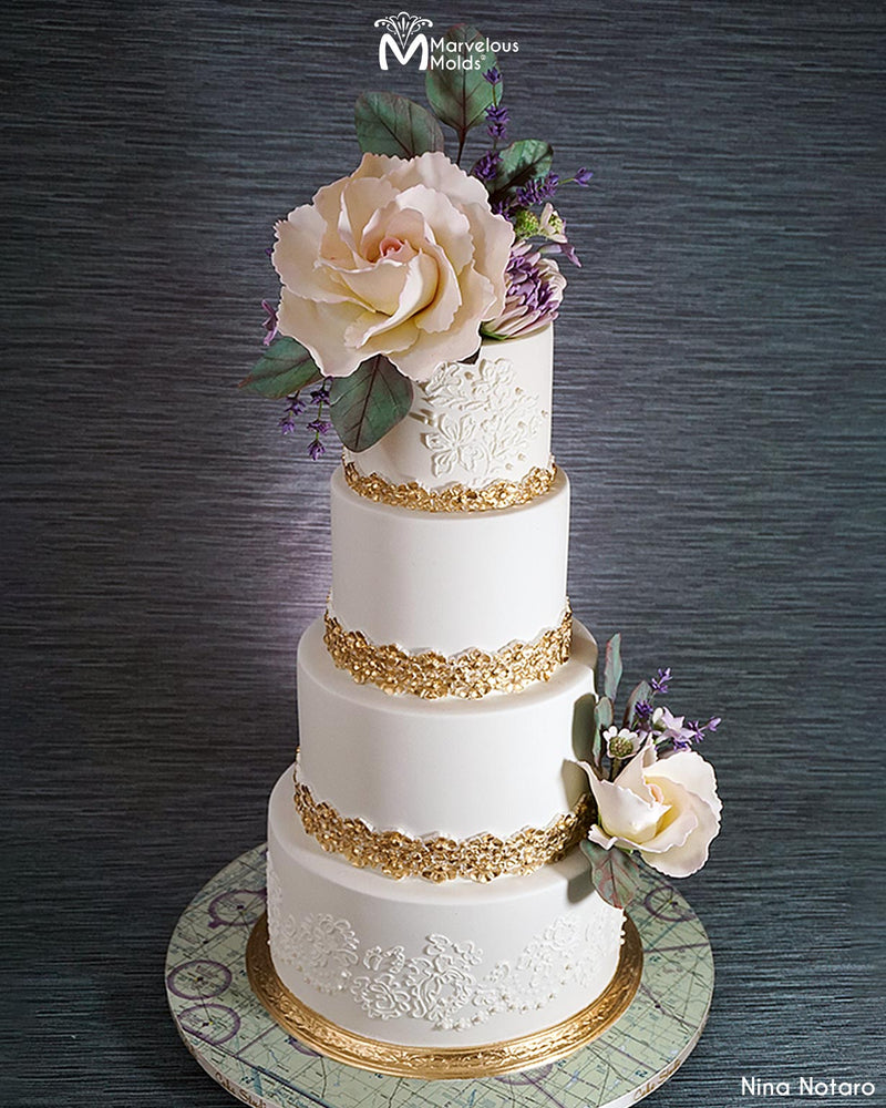 White Wedding Cake with Gold Borders Decorated Using the Splendor Border Silicone Mold by Marvelous Molds